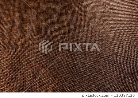 Woven Brown Cloth Displaying Intricate Texture in Natural Lighting for Textile Lovers Woven Brown Cloth Displaying Intricate Texture in Natural Lighting for Textile Lovers 120357126