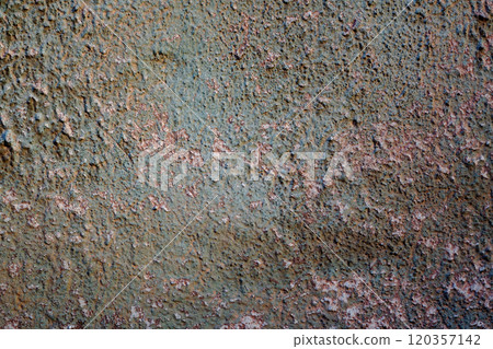 Wall with a texture of cement plaster small protrusions with peeled green paint. Rusty red spots 120357142