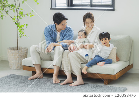 Young family, parents and children, living room Young family, parents and children, living room 120358470
