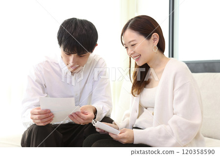 A couple looking at an ultrasound image A couple looking at an ultrasound image 120358590