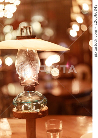 Nostalgic lamp-lit cafe Nostalgic lamp-lit cafe 120360845