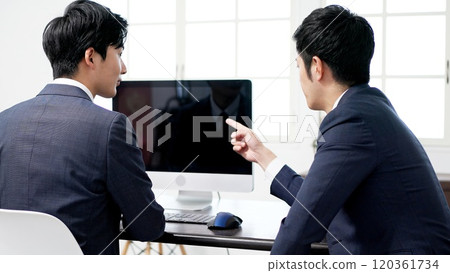 Businessmen looking at a screen and having a meeting Businessmen looking at a screen and having a meeting 120361734