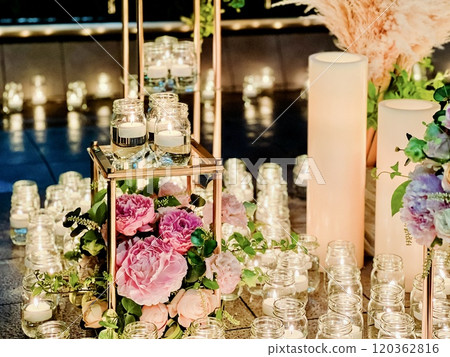 Beautiful flowers surrounded by candles Beautiful flowers surrounded by candles 120362816