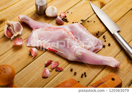 Raw lamb shoulder and condiments Raw lamb shoulder and condiments 120363079