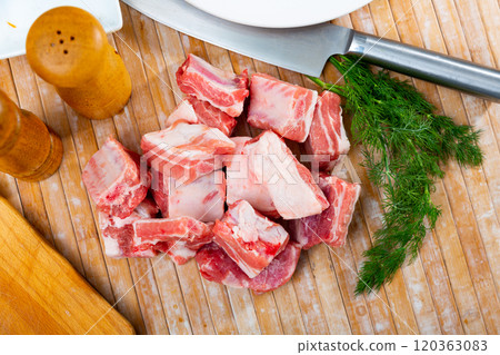 Chopped raw pork ribs on top of table Chopped raw pork ribs on top of table 120363083