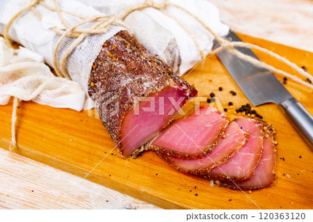 Sliced cured sirloin pork on wooden cuting board Sliced cured sirloin pork on wooden cuting board 120363120