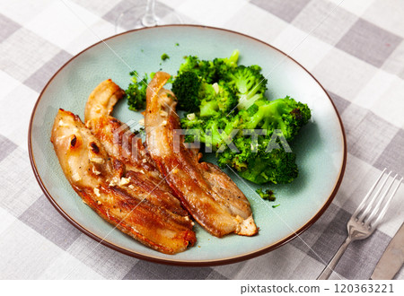 Roasted pork belly served with broccoli Roasted pork belly served with broccoli 120363221