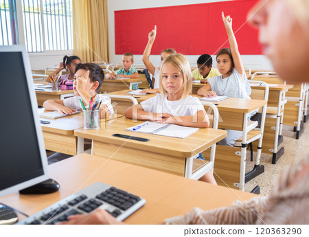 Group of focused children working at class 120363290