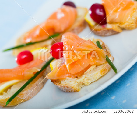 Sandwiches with salmon on white plate 120363368