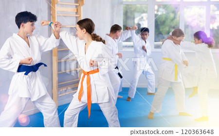 Boy and girl training karate techniques in studio Boy and girl training karate techniques in studio 120363648