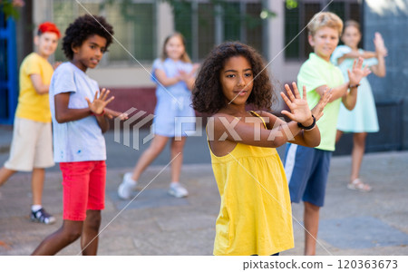 Girl dancing with friends outdoors Girl dancing with friends outdoors 120363673