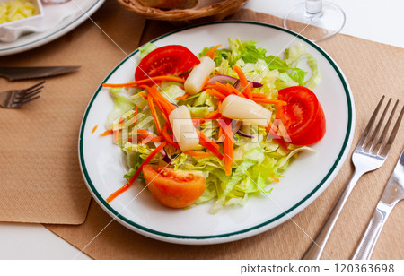 Salad from fresh lettuce, tomato, onion, grated carrot and pickled asparagus Salad from fresh lettuce, tomato, onion, grated carrot and pickled asparagus 120363698