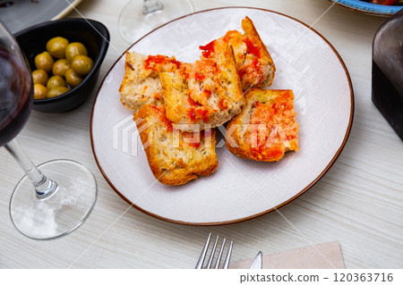 Traditional Spanish toasted bread with tomato with olive oil Traditional Spanish toasted bread with tomato with olive oil 120363716
