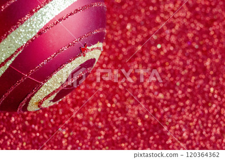 Close up view of Christmas ball on red background with customizable space for text or for wishes. Christmas celebration concept. 120364362