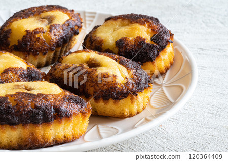 Pastries on a plate 120364409