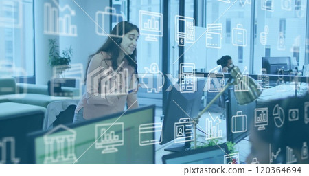 Business data and analytics image over woman enjoying music in office 120364694