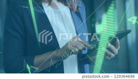 Analyzing financial data over businesswoman using tablet 120364696