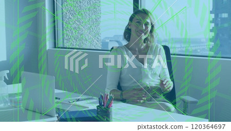 Financial data processing image over businesswoman sitting at office desk 120364697