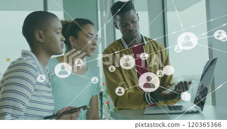 Image of network of connections with people icons over diverse business people in office Image of network of connections with people icons over diverse business people in office 120365366