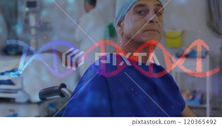 Image of dna strand over caucasian male surgeon Image of dna strand over caucasian male surgeon 120365492