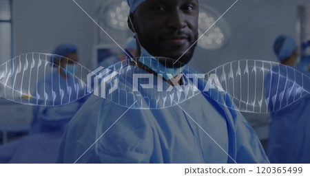 Image of dna strand over afcian american male surgeon Image of dna strand over afcian american male surgeon 120365499