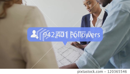 Business team reviewing architectural plans with 940,158 followers image over Business team reviewing architectural plans with 940,158 followers image over 120365546