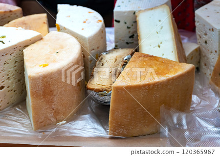 Cheese Wheels for Sale at the Counter Cheese Wheels for Sale at the Counter 120365967