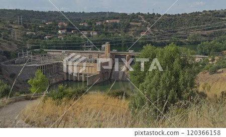 Hydroelectric Power Station in a Deep Canyon with Moving Tree Branches Hydroelectric Power Station in a Deep Canyon with Moving Tree Branches 120366158