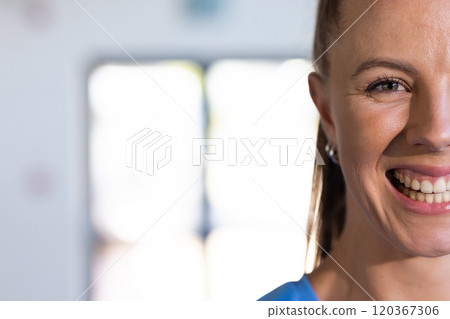 Smiling woman in sportswear, showing happiness and confidence in basketball setting, copy space 120367306