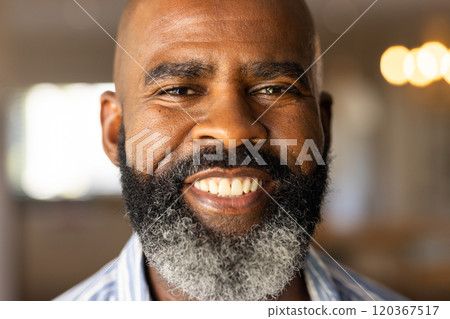 Smiling African American senior man with beard looking at camera, feeling happy and confident 120367517