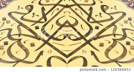 Islamic calligraphy characters on paper with a hand made calligraphy pen Islamic calligraphy characters on paper with a hand made calligraphy pen 120368852