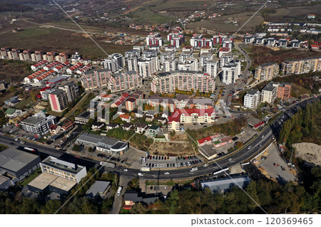 Aerial view of a large urban residential area with numerous high-rise apartment blocks 120369465