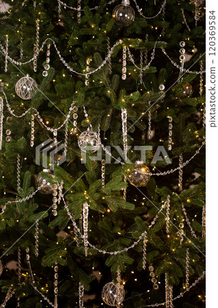 A Christmas tree with many ornaments A Christmas tree with many ornaments 120369584