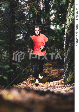 A man runs in the woods A man runs in the woods 120369594