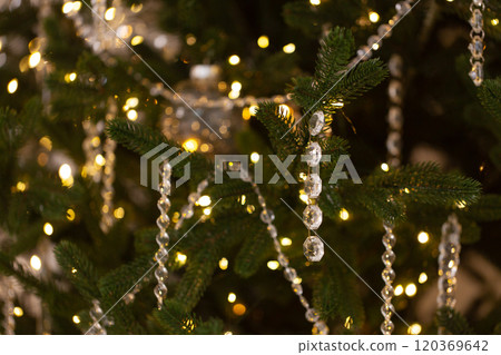 A Christmas tree with a lot of lights and crystal decorations A Christmas tree with a lot of lights and crystal decorations 120369642