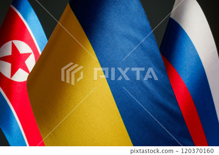 Flags of Ukraine, Russia, and North Korea. 120370160