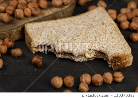 hazelnuts and bread with nut paste with chocolate 120370382