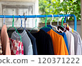 Hang the clothes on the clothesline 120371222