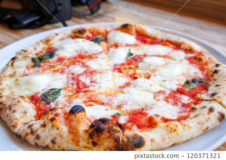 Authentic Margherita pizza with delicious cheese 120371321