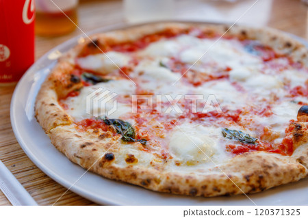 Authentic Margherita pizza with delicious cheese Authentic Margherita pizza with delicious cheese 120371325