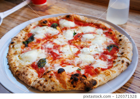 Authentic Margherita pizza with delicious cheese Authentic Margherita pizza with delicious cheese 120371328
