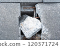 Broken concrete and exposed rebar 120371724