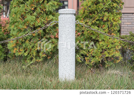 Stone pillar and chain in the park Stone pillar and chain in the park 120371726