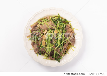 Fried pea sprouts and beef with garlic Fried pea sprouts and beef with garlic 120371758