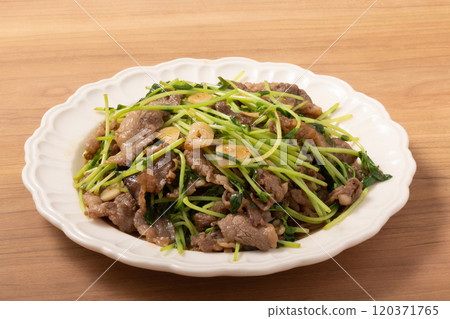 Fried pea sprouts and beef with garlic Fried pea sprouts and beef with garlic 120371765