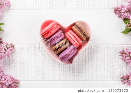 Colorful macaroons, arranged in a delightful display of vibrant hues Colorful macaroons, arranged in a delightful display of vibrant hues 120373570