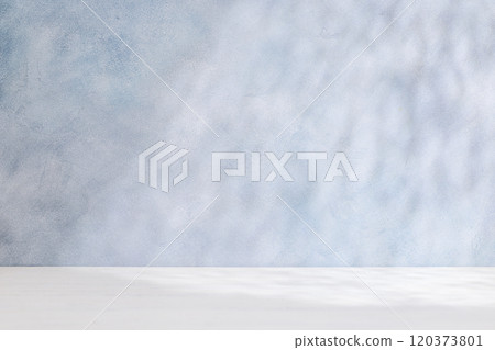 Template with empty table and wall with natural shadow and sunny glare 120373801