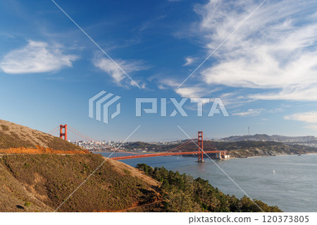 Iconic view of the Golden Gate Bridge bathed in warm sunlight 120373805