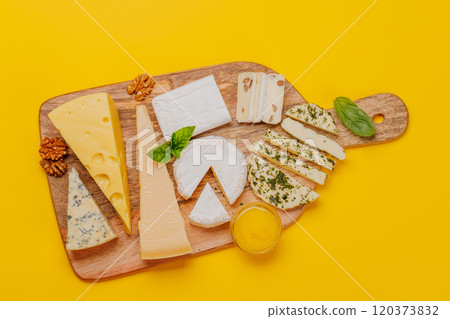 An assortment of various cheeses arranged on a board, highlighting different textures An assortment of various cheeses arranged on a board, highlighting different textures 120373832