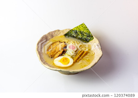 A delicious bowl of ramen being prepared  120374089